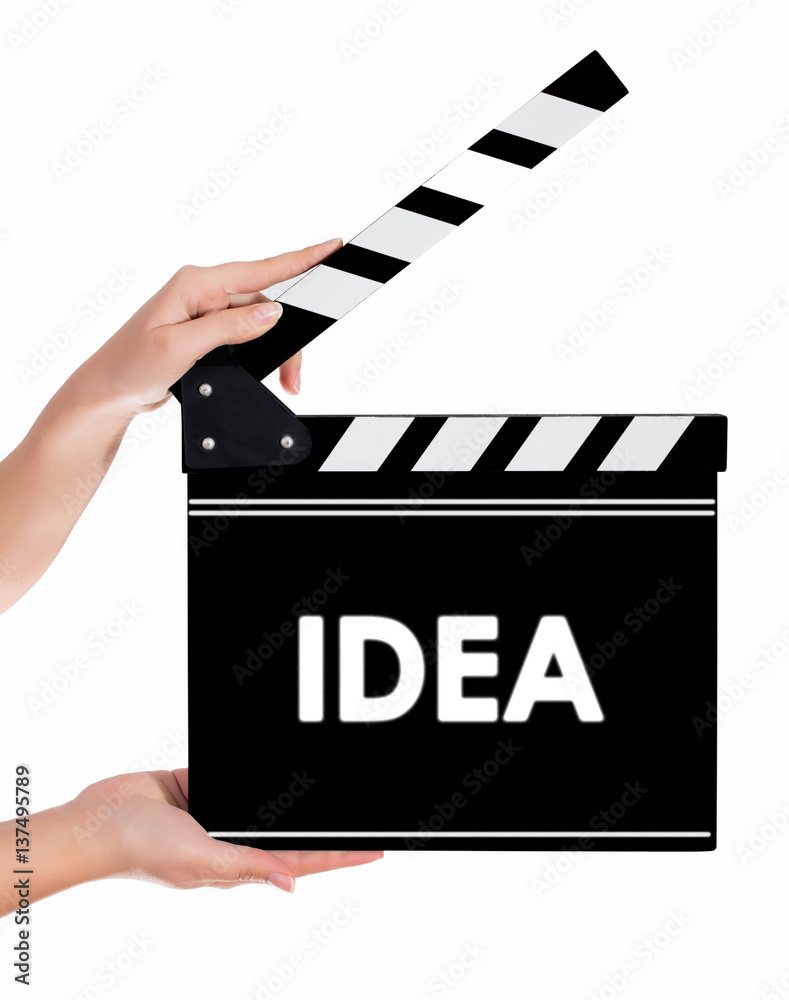 Hands holding a clapper board with IDEA text
