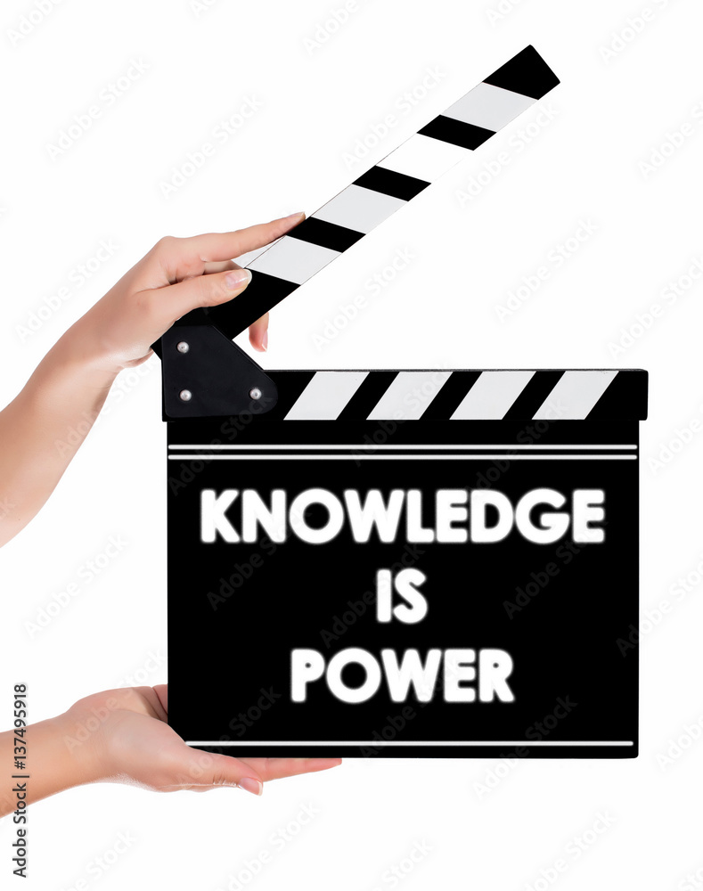 Hands holding a clapper board with KNOWLEDGE IS POWER text