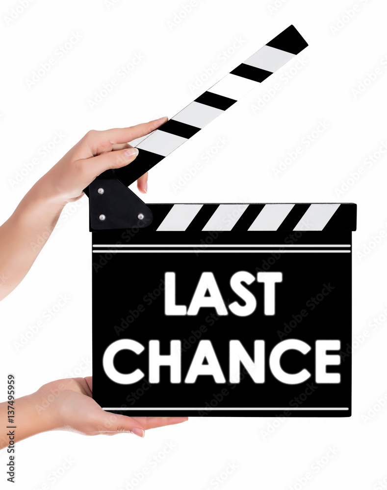Hands holding a clapper board with LAST CHANCE text