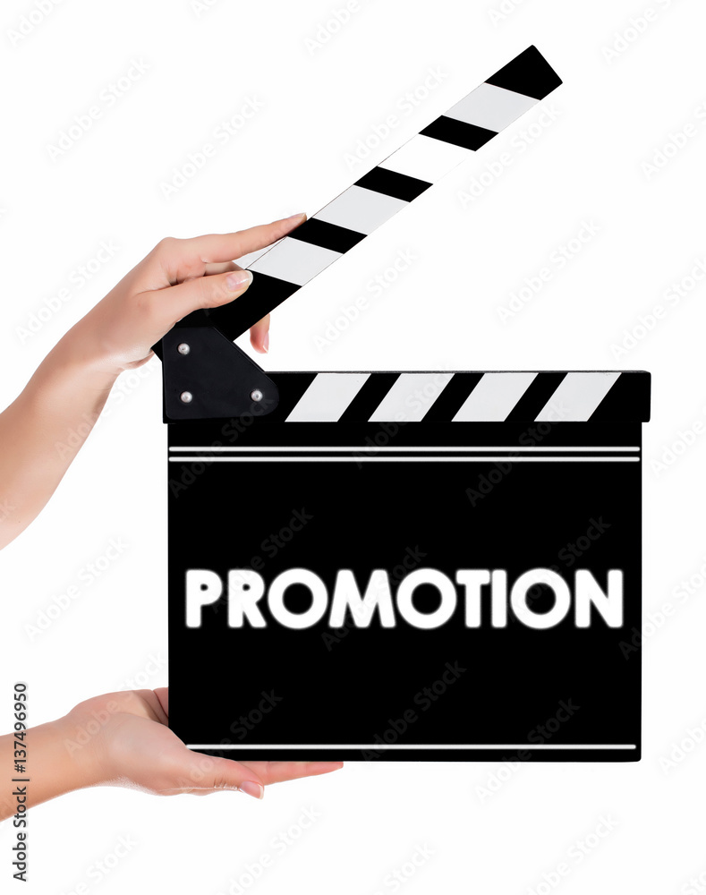 Obraz premium Hands holding a clapper board with PROMOTION text