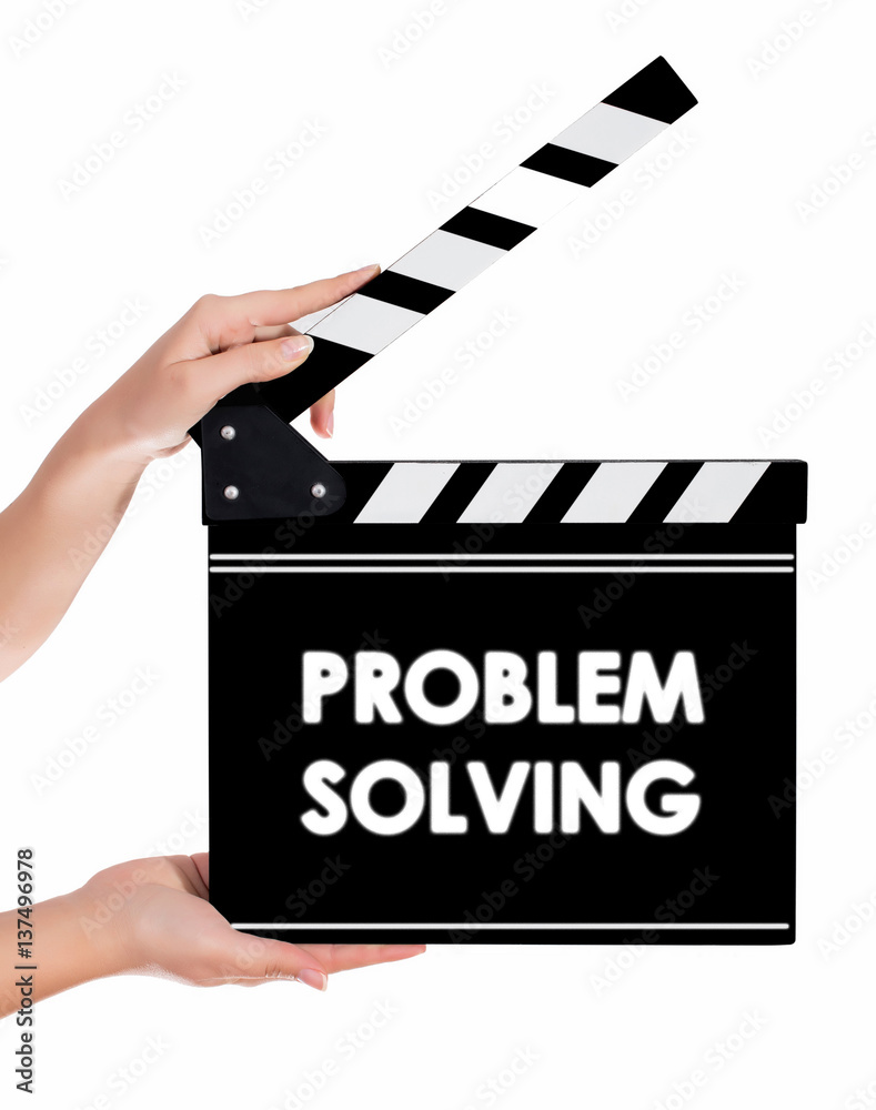 Hands holding a clapper board with PROBLEM SOLVING text