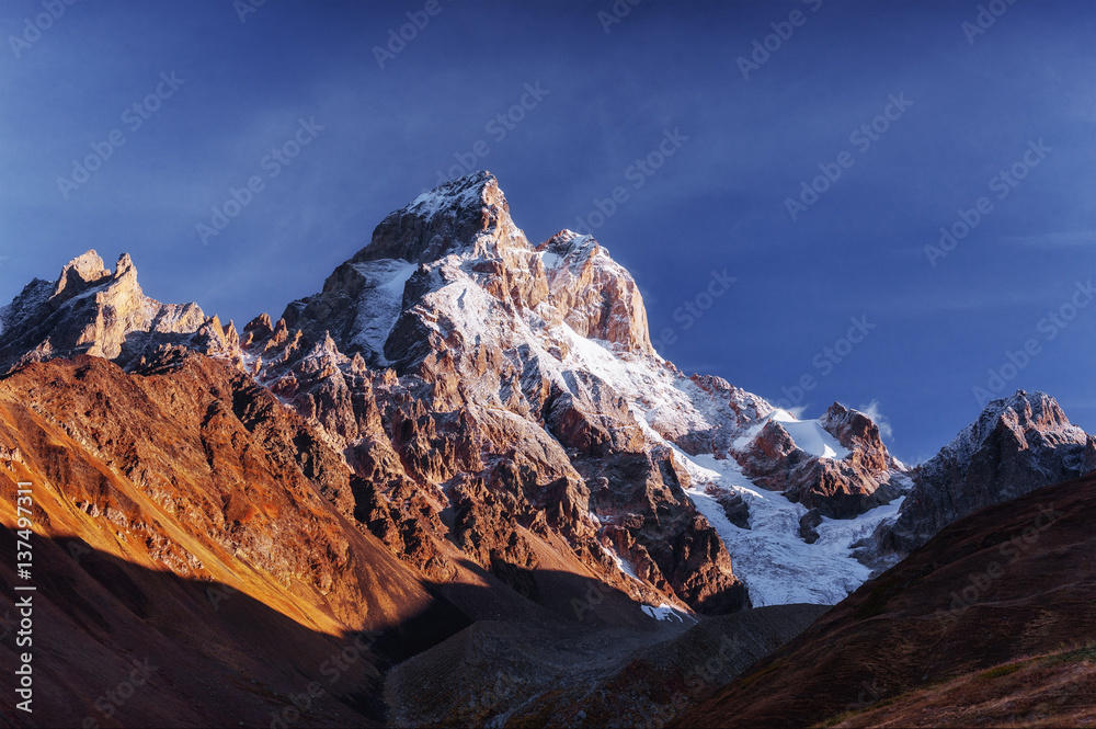 Fantastic scenery and snowy peaks in the first morning sunlight.