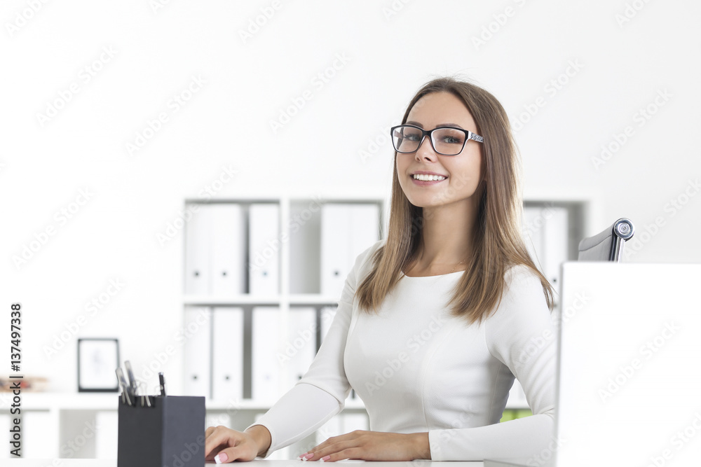 Front view of smiling businesswoman in glasses Front view of smiling businesswoman in glasses