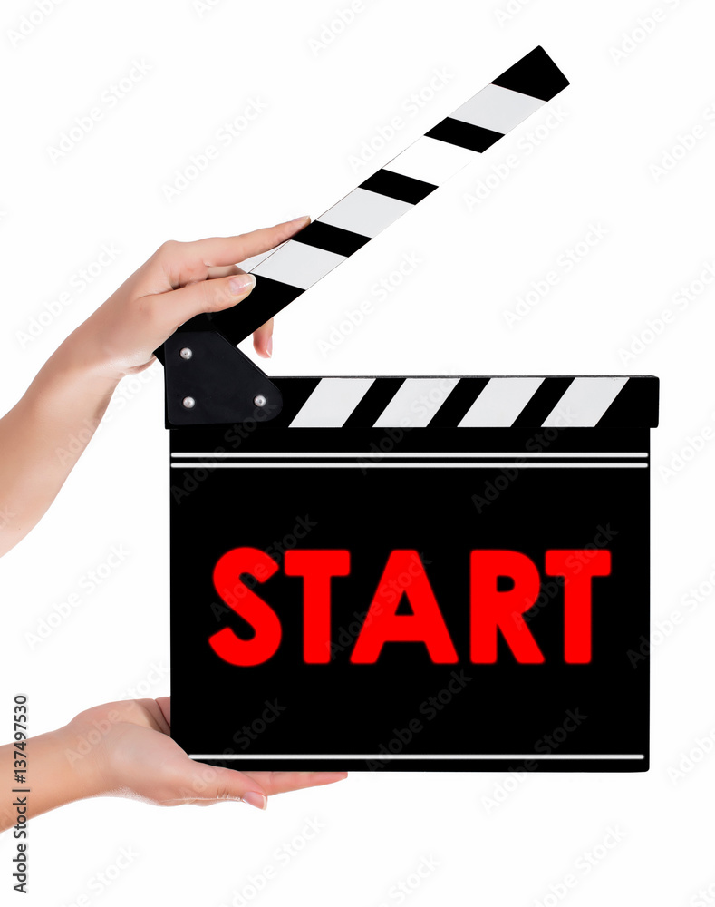Hands holding a clapper board with START text