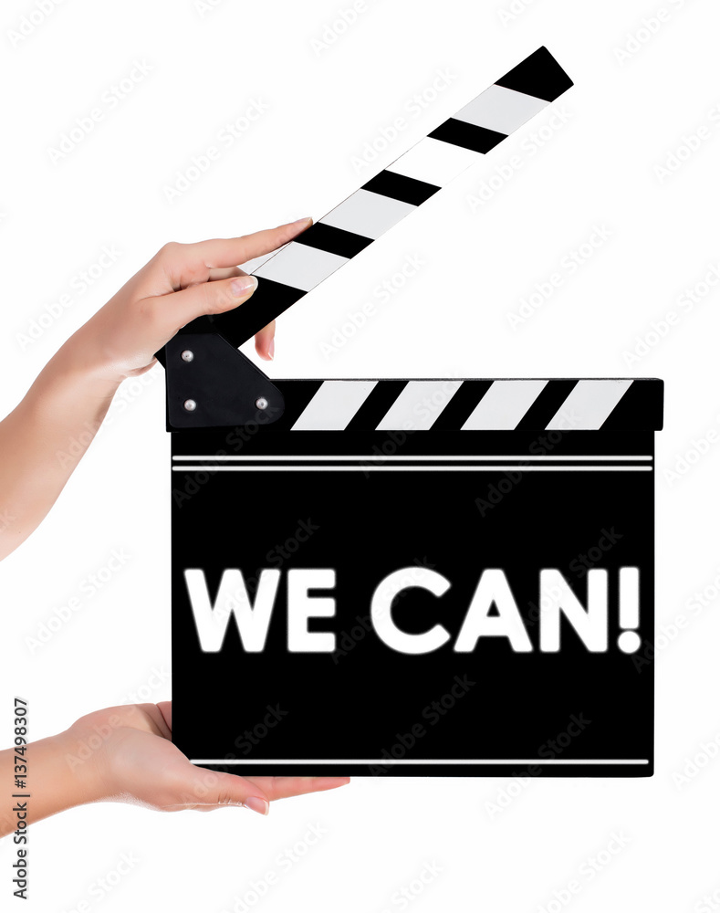 Hands holding a clapper board with WE CAN text