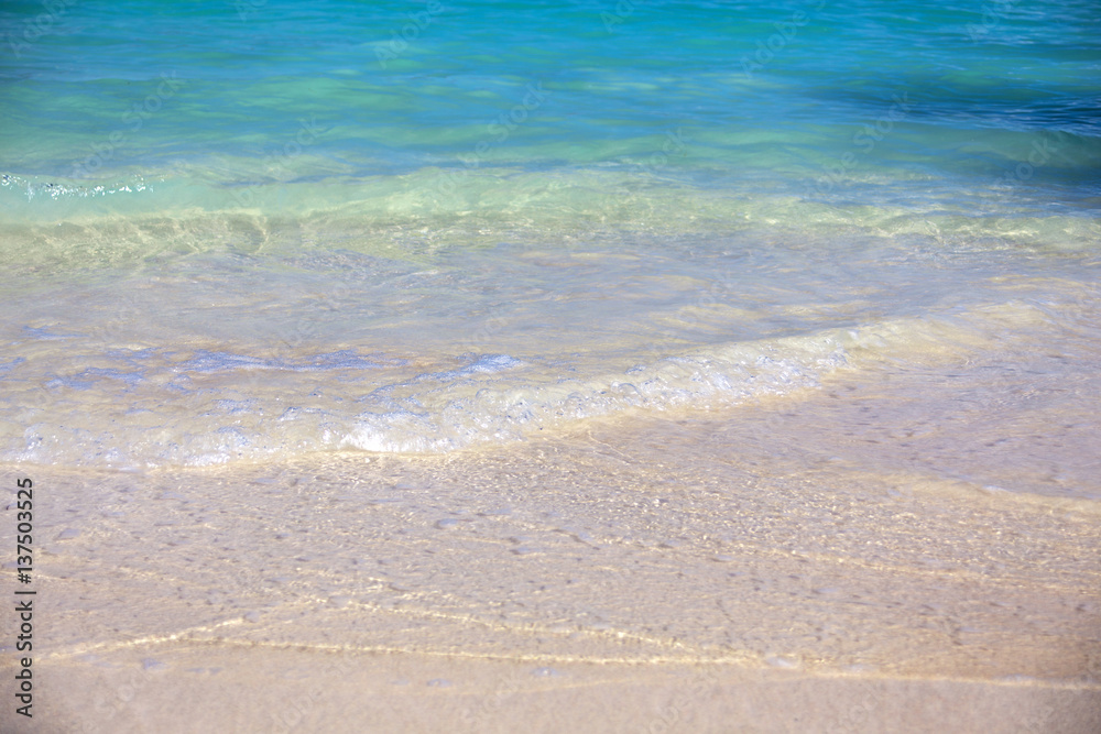 Blue Ocean Wave on white Sandy Beach. Background.