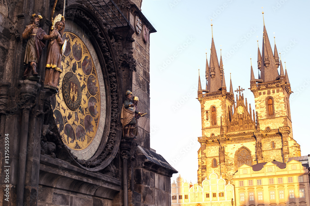 Obraz premium Prague. Czech Republic. Astronomical clock on Old Town square and Church of Our Lady before Tyn captured at golden hour.