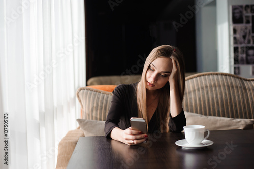 tired business woman working with mobile phone during a break