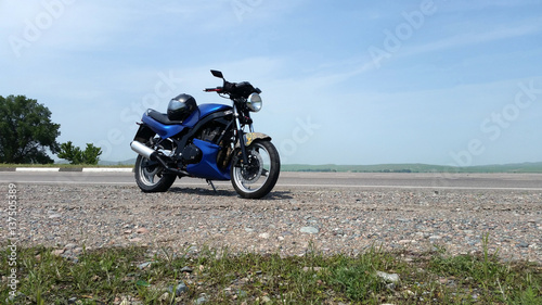 Blue motorbike on the road