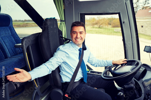 Canvas Print happy driver inviting on board of intercity bus