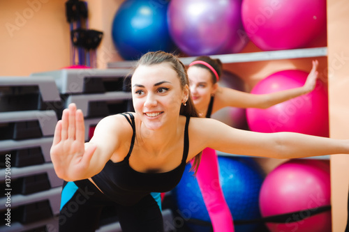 Beautiful women exercising aerobics in fitness club