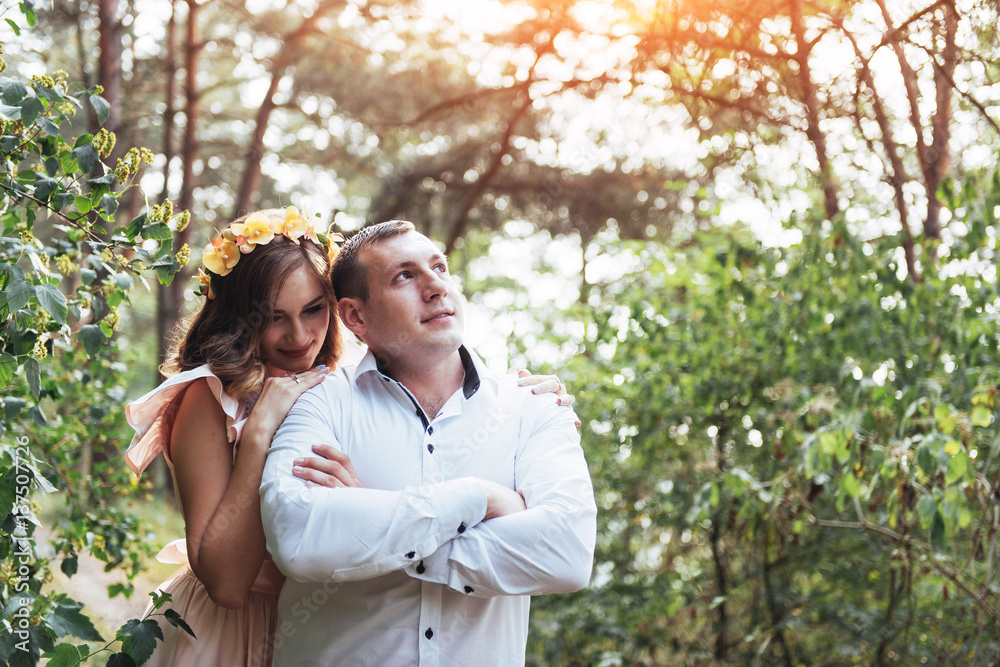 Beautiful happy couple on a walk in the woods Beautiful happy couple on a walk in the woods