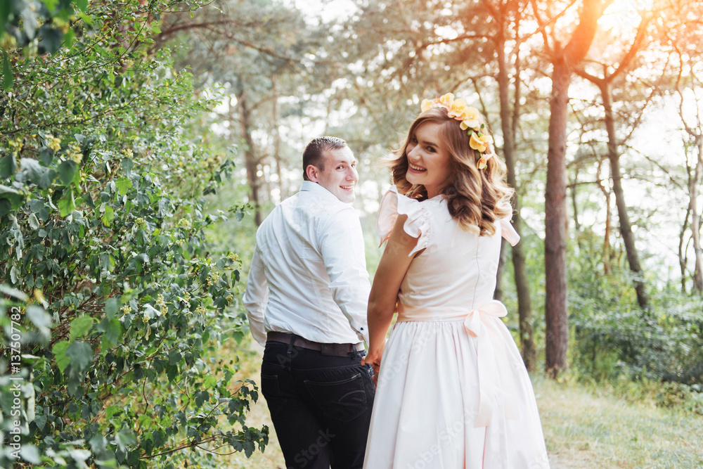 Happy couple in a pine forest Beauty world