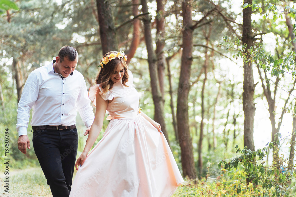 Happy couple in a pine forest Beauty world