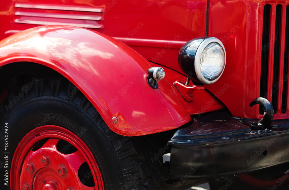 Vintage red car headlight, black wheels truck Retro transport concept photo