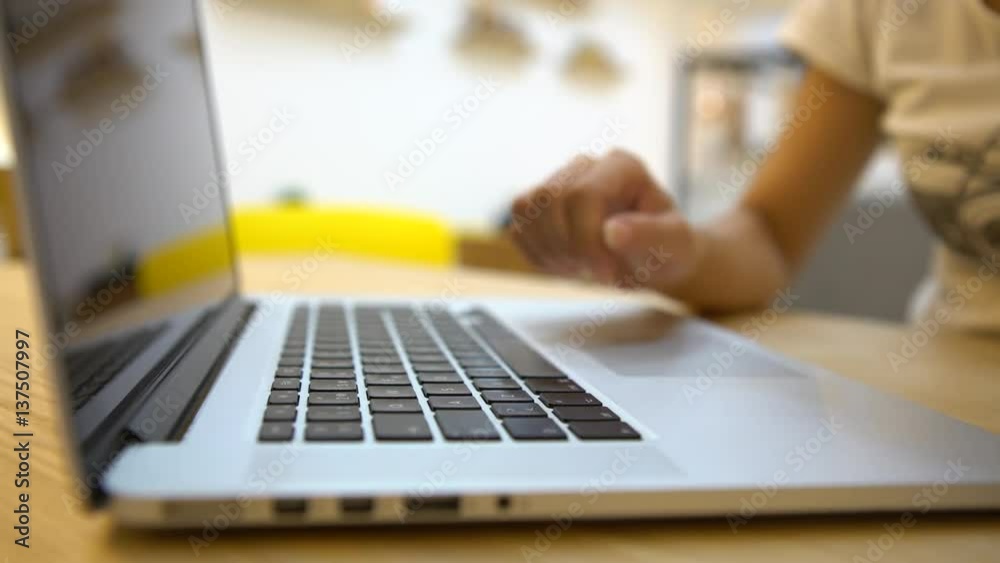 4K Close Up Of Young Asian Business woman using cell phone and laptop computer for work in a coffeeshop.-Dan 4K Close Up Of Young Asian Business woman using cell phone and laptop computer for work in a coffeeshop.-Dan