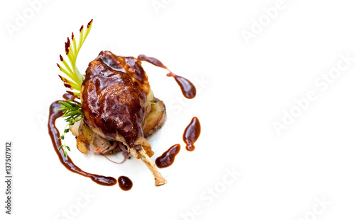 Duck pestle confit with potato. Roasted poltry meat leg seasoned garlic bacon sauce. White background Up view, copy space photo