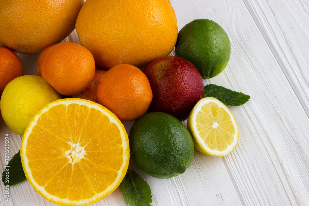 Lemon,red orange, orange, grapefruit, lime on old wooden table. Background. Lemon,red orange, orange, grapefruit, lime on old wooden table. Background.