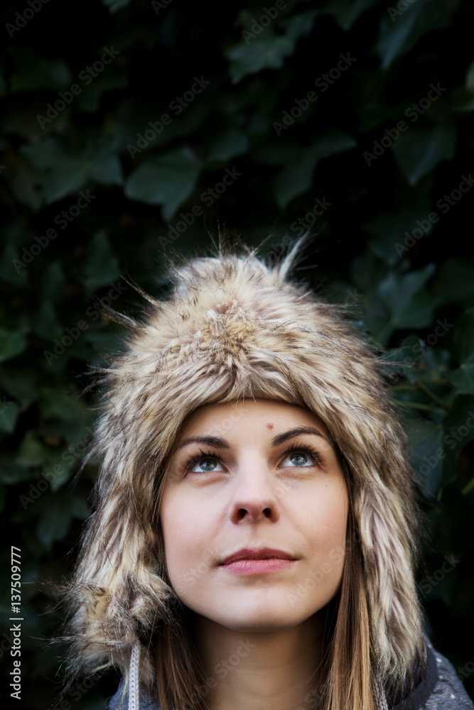 Portrait of young woman in furry cap, winter. Portrait of young woman in furry cap, winter.