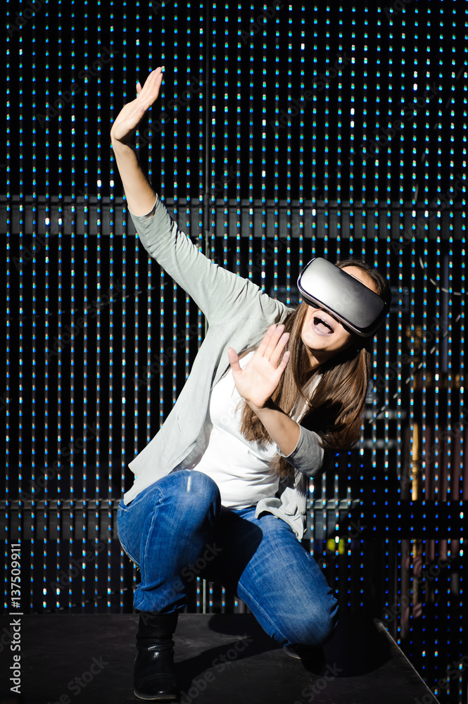 Double exposure of happy woman using VR-headset glasses for virtual reality concept Double exposure of happy woman using VR-headset glasses for virtual reality concept