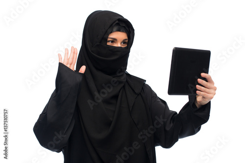 muslim woman in hijab with tablet pc computer