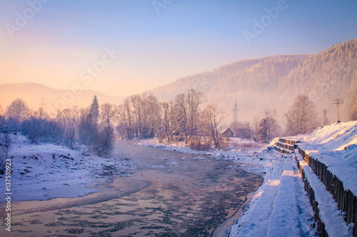 Misty dawn in the mountains, mountain river. Sunrise in the mountains