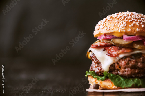 a delicious and juicy burger home in a rustic style with a big chop of beef