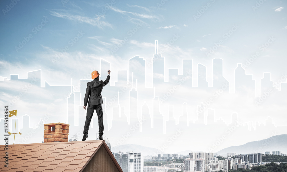 Man architect draw silhouette of modern city on blue sky. Mixed Man architect draw silhouette of modern city on blue sky. Mixed