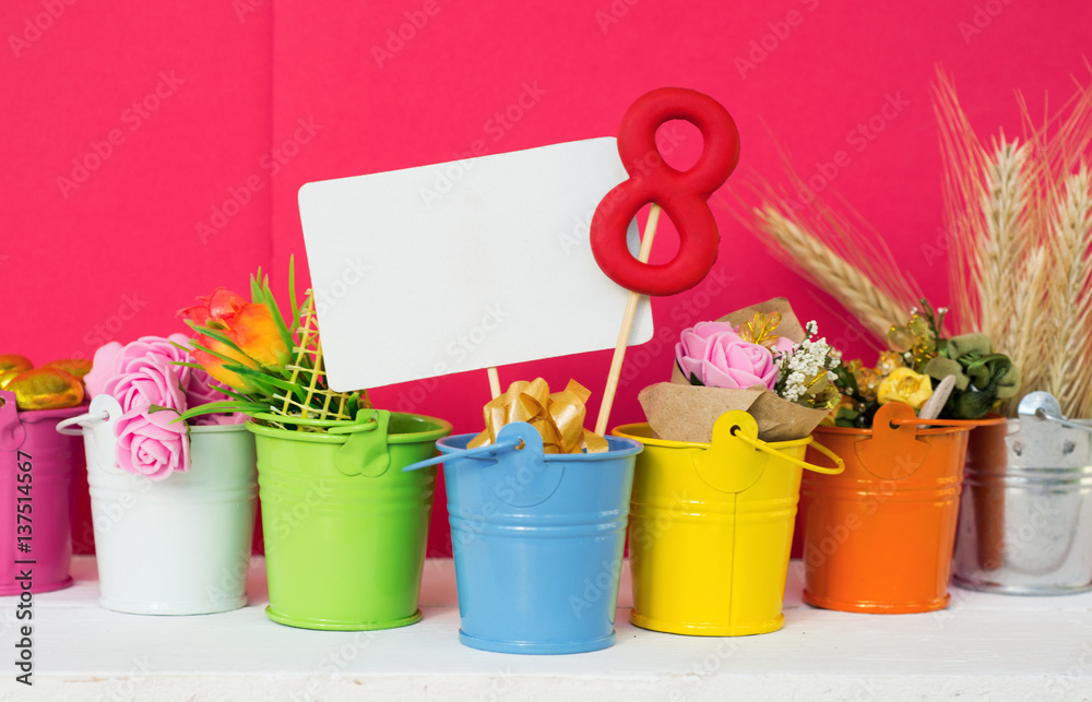 lollipop  shape figure eight 8, note for text, flowers in colored buckets. Happy International Women’s Day celebrate on March 8, congratulatory CARD. 