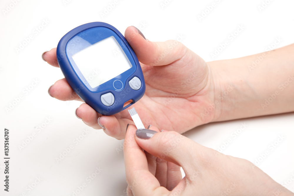 Close-up Of Woman Hands Testing High Blood Sugar With Glucometer Close-up Of Woman Hands Testing High Blood Sugar With Glucometer