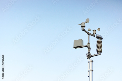Weather station on blue sky background