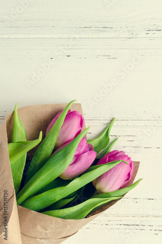 Tulip flowers on white shabby chic background