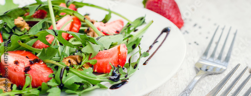 Fresh salad with arugula and strawberries