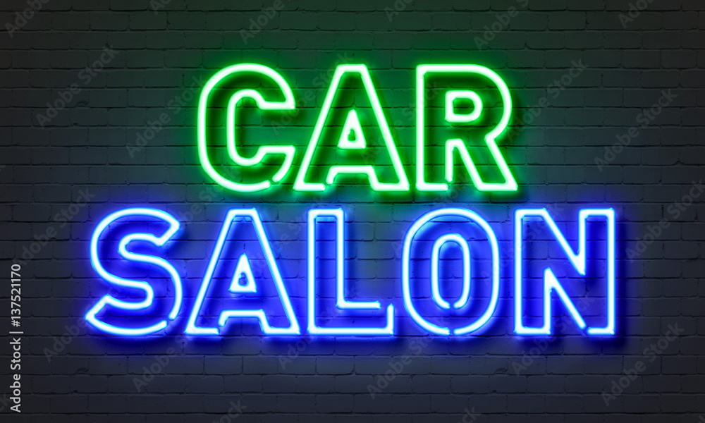 Car salon neon sign on brick wall background.