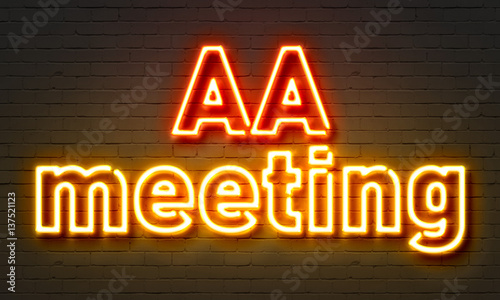 AA meeting neon sign on brick wall background. photo