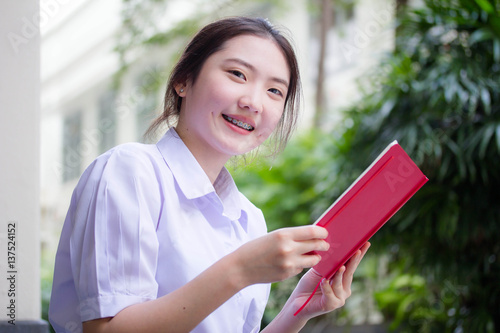 asia thai high school student uniform beautiful girl read a book