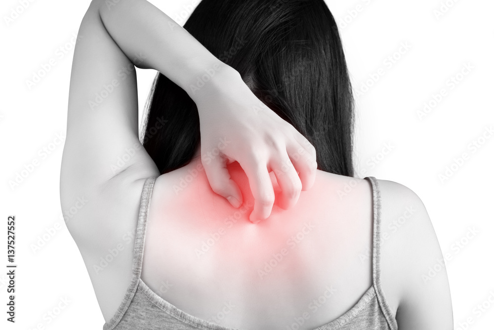 Scratching her back in a woman isolated on white background. Clipping ...