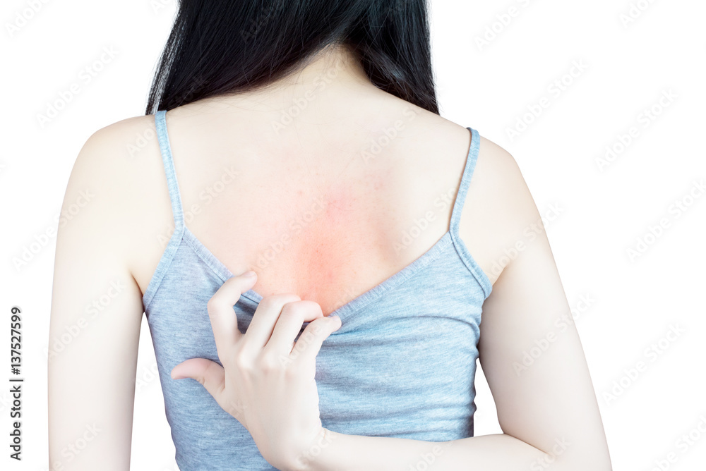 Scratching her back in a woman isolated on white background. Clipping ...
