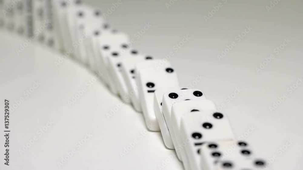 built figure of dominoes falling in slow motion