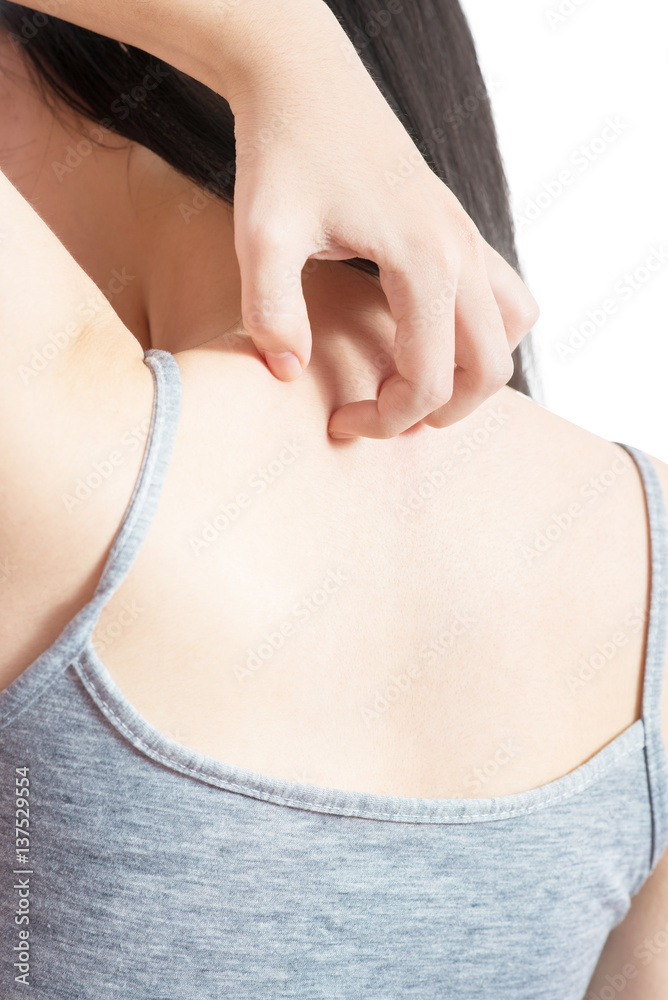 Scratching her back in a woman isolated on white background. Clipping ...