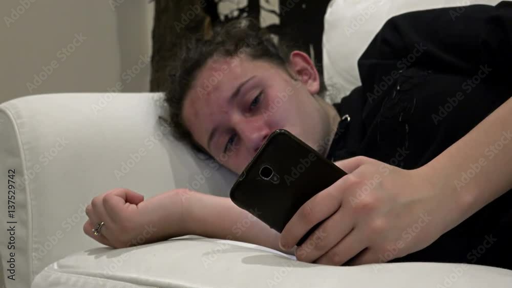 Sad crying girl using Smartphone Sad crying girl using Smartphone