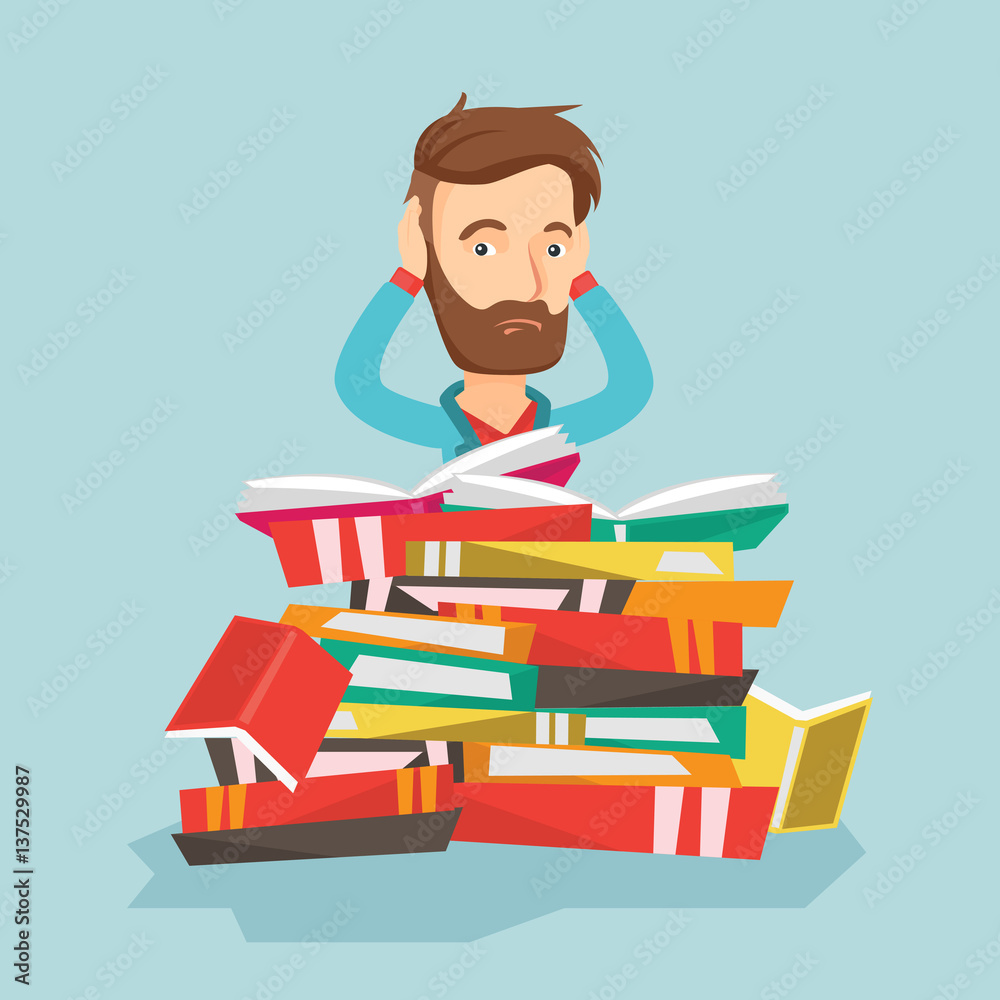 Student sitting in huge pile of books.