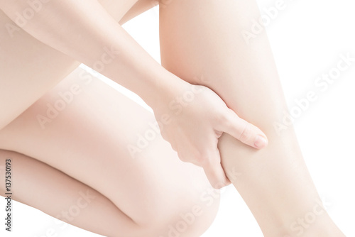 Acute pain in a woman  calf leg isolated on white background. Clipping path on white background.