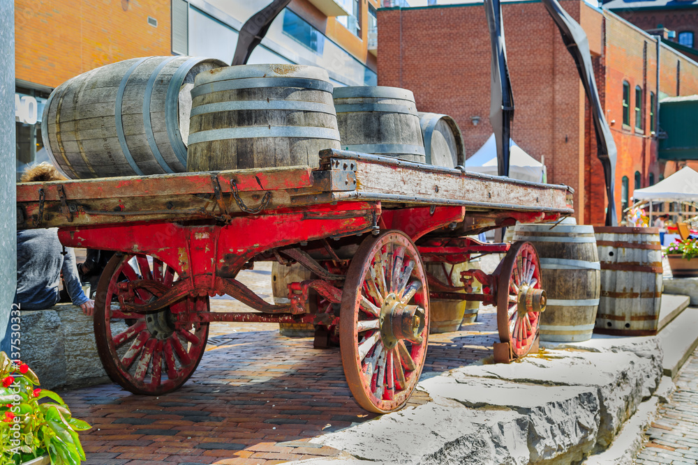 amazing closeup rear view of vintage classic horse drawn carriage loaded with wooden barrels