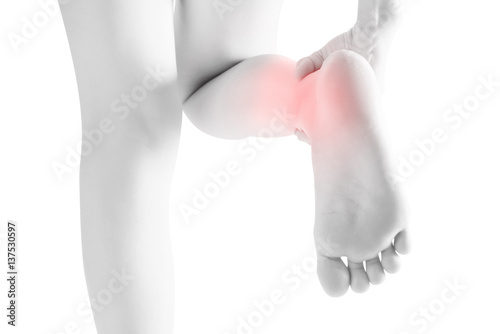 Acute pain in a woman  ankle isolated on white background. Clipping path on white background © chatchai