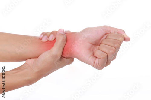 Wrist pain.Female holding hand to spot of wrist pain