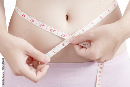 Woman measuring obese isolated on white background. Clipping path on white background.