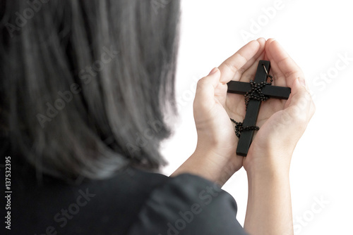Hands of a asia woman Praying with Rosary, isolated on white background. Clipping path on white background.