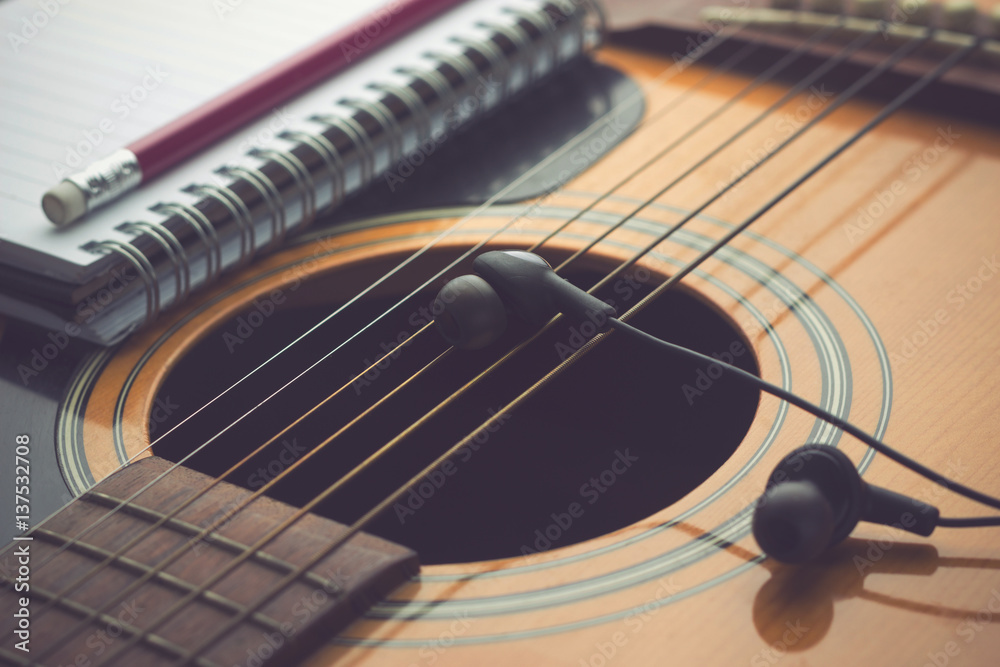Fototapeta premium Headphones on guitar, Writing music