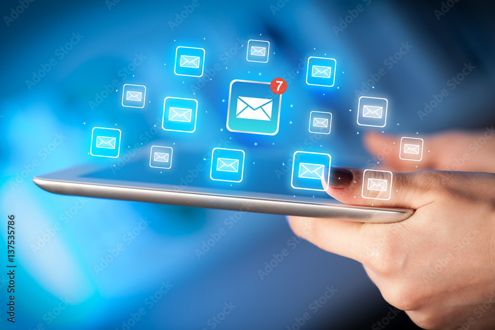 Fingers touching tablet with mail Fingers touching tablet with mail